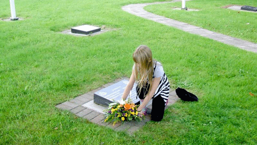 [ Laying flowers on her daddies memorial stone in the Palace Barracks Memorial Garden August 8th 2010 ]
